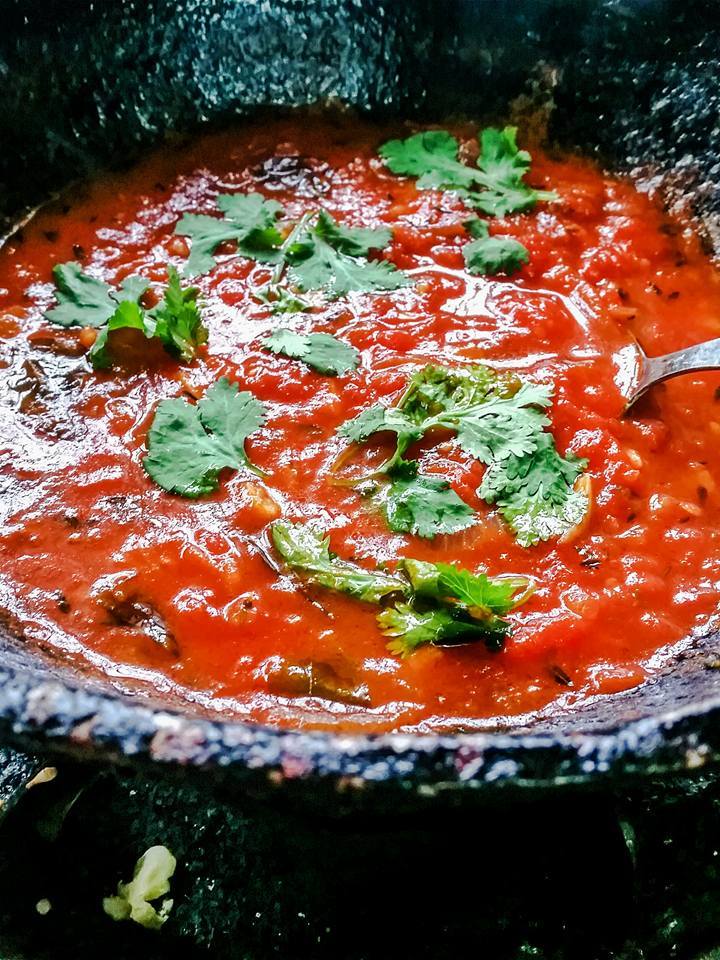 Mauritian Rougaille being cooked in the rustic GrandMa Kadhai (Cooking Pot)