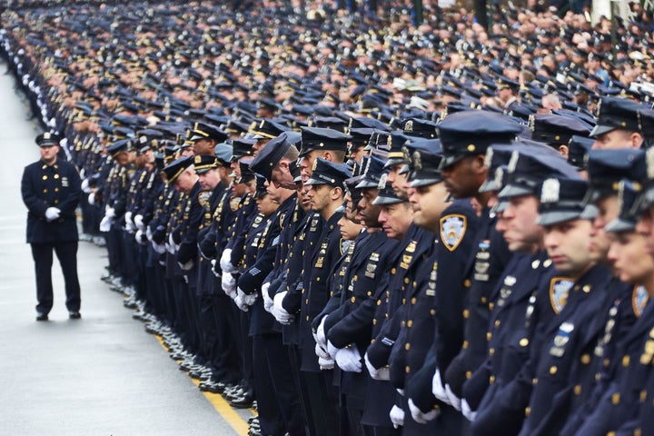 Police officers gather for the funeral of NYPD Officer Wenjian Liu. Liu and his partner, Rafael Ramos, were gunned down by Ismaaiyl Brinsley in December 2014. 