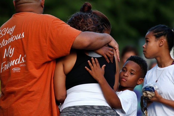 Keaka Wallace (center), who said she was a patrol partner of slain DART officer Brent Thompson, weeps at Dallas Police Headquarters following the multiple police shootings on Thursday.