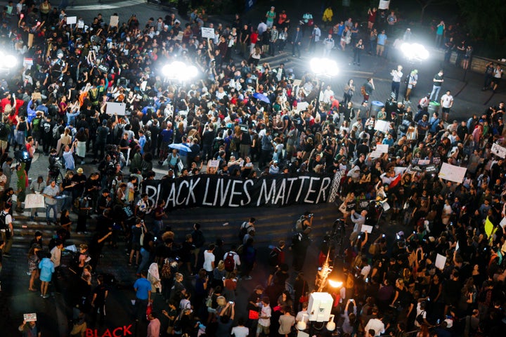 People take part in a protest against police brutality and in support of Black Lives Matter during a march in New York July 9, 2016.