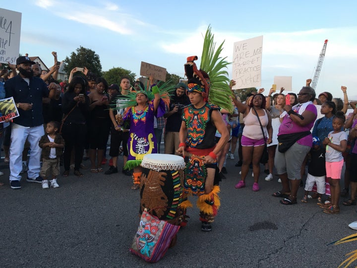 A member of the indigenous Mexica Tribe from the Kalpulli Yaocenoxtli dance group drums on I-94 during a protest takeover of the freeway.