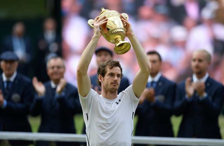 <strong>Murray holds his trophy aloft following his victory</strong>