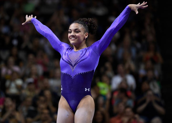 Laurie Hernandez from Old Bridge, New Jersey, reacts after completing her balance beam routine in the women's gymnastics trials.