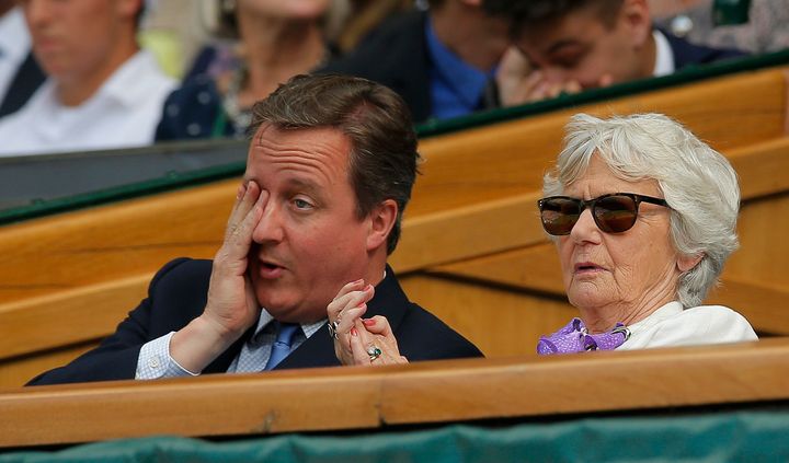 <strong>David Cameron, pictured at Wimbledon with his mother Mary, was booed by the crowd</strong>