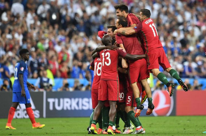 Portugal players celebrate after they scored a goal during the Euro 2016 final football match between Portugal and France at the Stade de France in Saint-Denis, north of Paris, on July 10, 2016. (FRANCISCO LEONG/AFP/Getty Images)