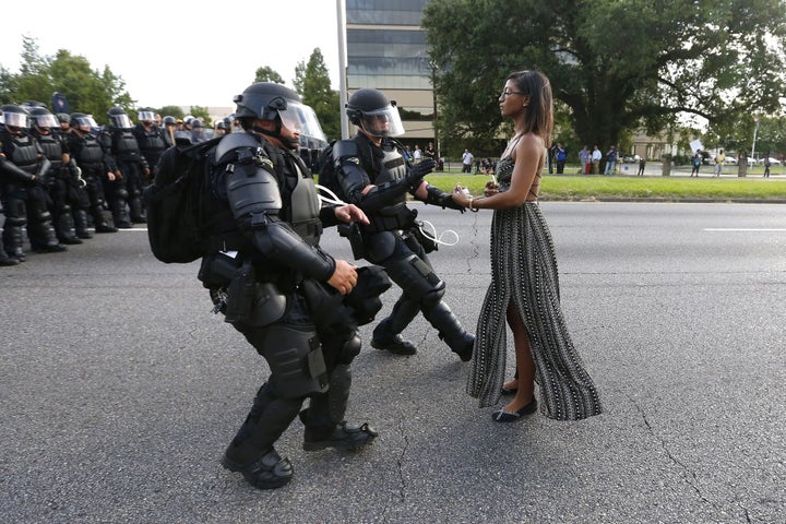 A woman's peaceful act of resistance during a protest in Baton Rouge, Louisiana, has become the symbol of a powerful moment in the Black Lives Matter movement.