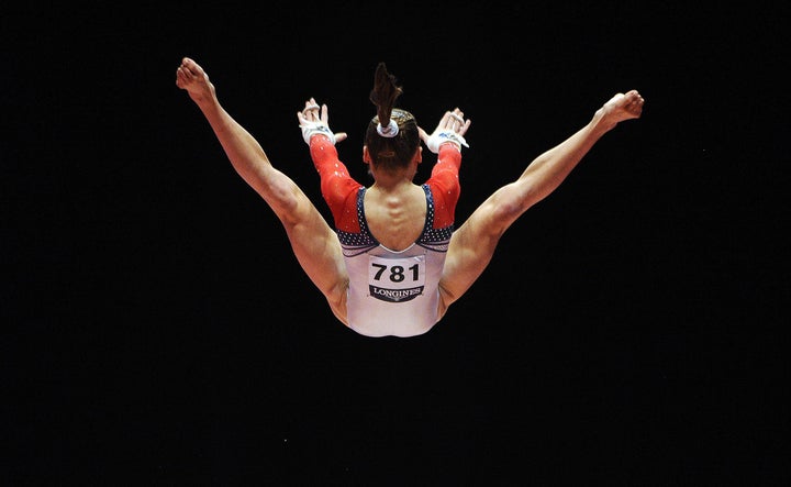 Madison Kocian performs on the uneven bars.