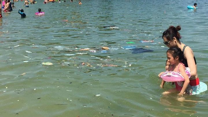 Trash floats in the waters of one of Hong Kong's beaches.