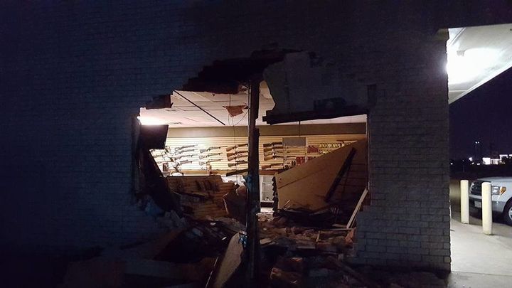 Police say that the suspects rammed a truck through the wall of this gun store.