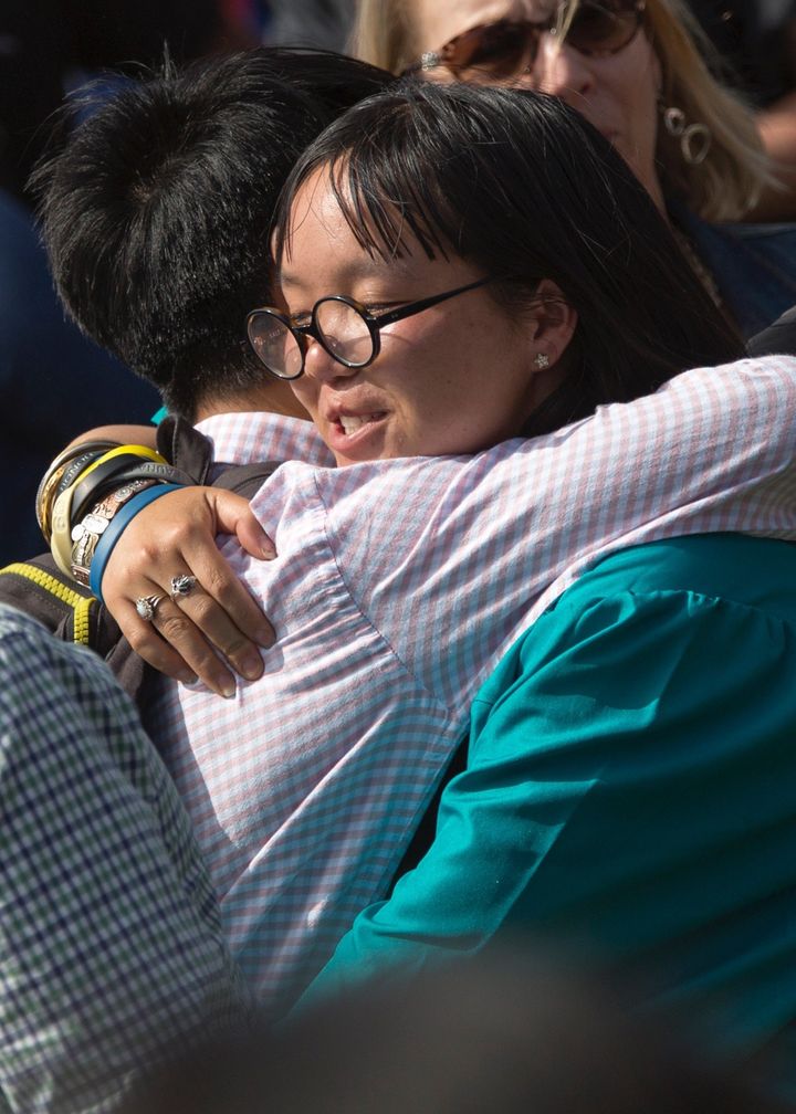 The author's children hugging one another at her daughter's recent graduation.
