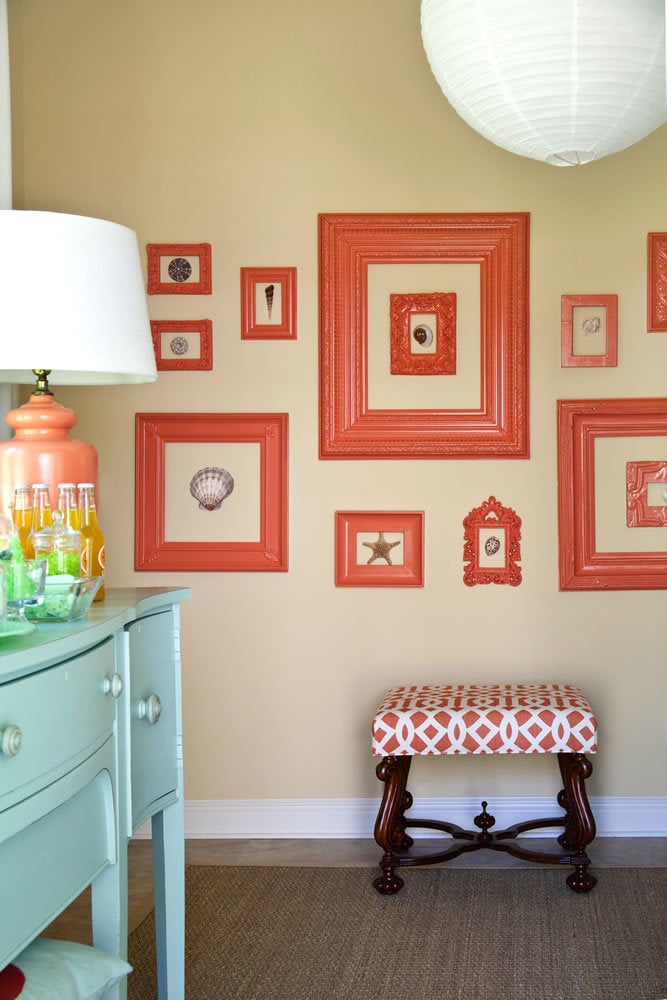 Glassless frames surround shells to create a mural.