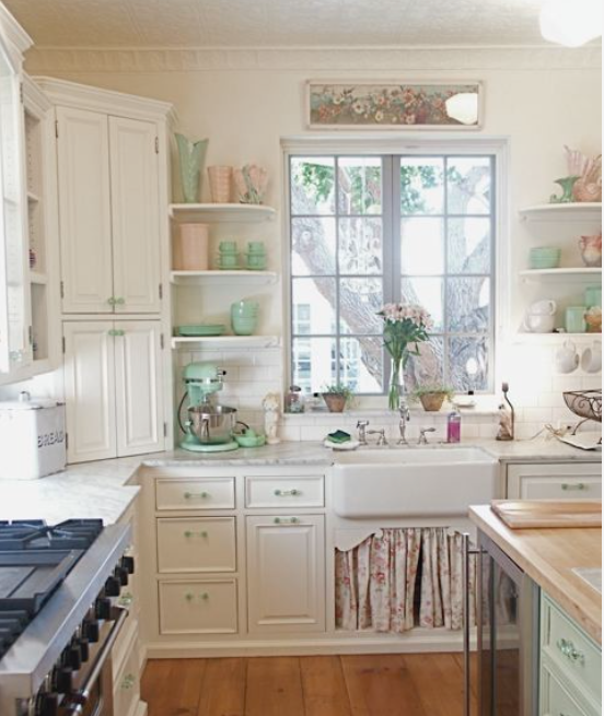 Accessories bring color to a white kitchen. 