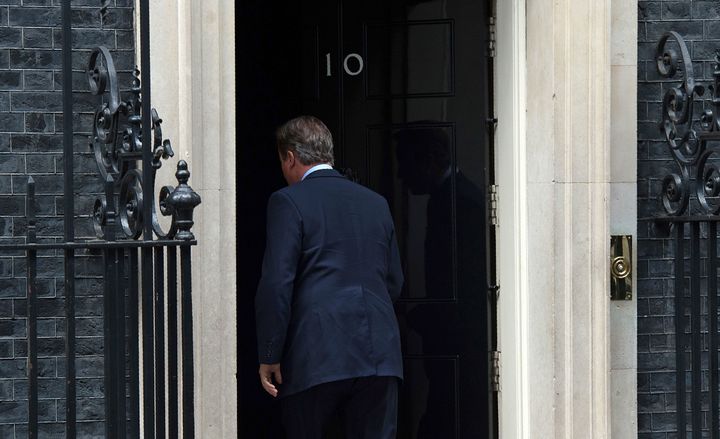 <strong>The outgoing PM walks back into Downing Street, mid 'Cameron's lament'</strong>