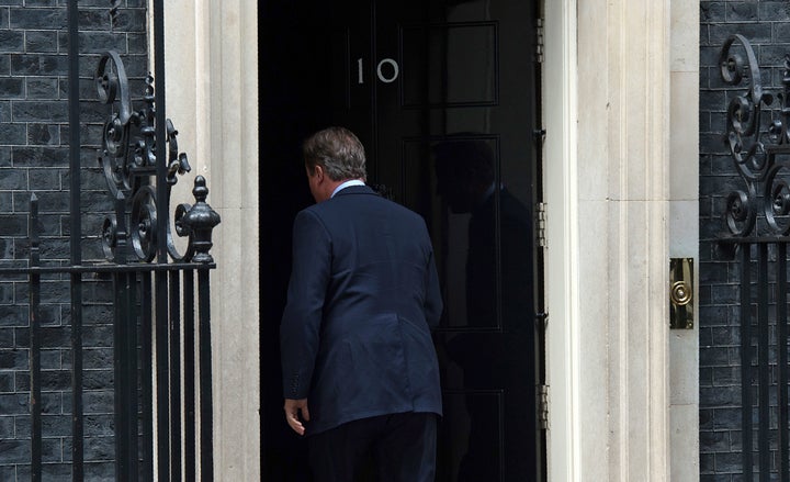 The outgoing PM walks back into Downing Street, mid 'Cameron's lament'