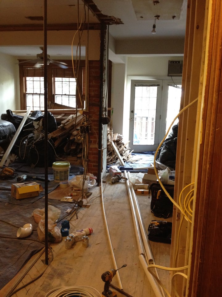 <p>This is a fixer upper, in process. Imagine living in this disaster. I did. I was just outside this shot, holding our 3 week old, trying to find somewhere clean to change and feed her.</p>