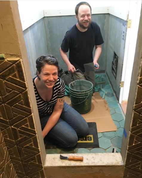 Me and Loren setting tile in a client's bathroom.