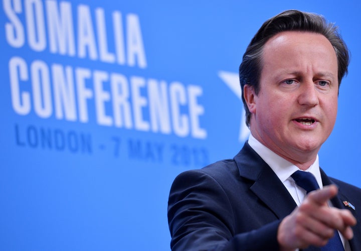 Cameron speaks alongside Somali President Hassan Sheikh Mohamud (not seen) during a 2013 press conference at the Foreign and Commonwealth Office