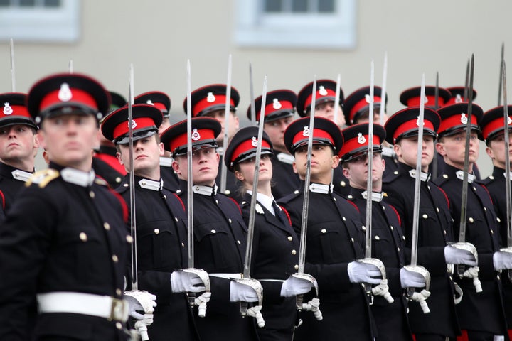 Male and female cadets platoons pass out together for the first time during the Sovereign's Parade at the Royal Military Academy Sandhurst.