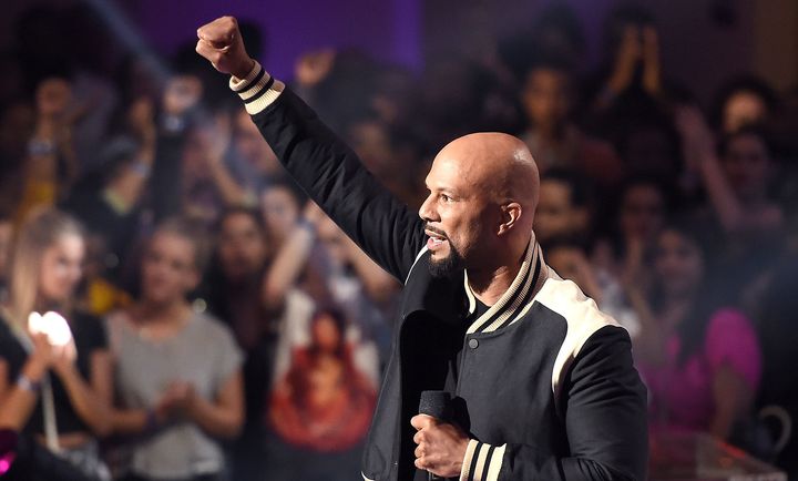 Common puts a fist in the air for black women at the VH1 Hip-Hop Honors on Monday.