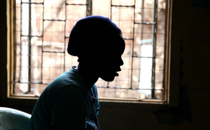 A girl who trades sex for basic needs speaks during an interview with Reuters about HIV/AIDS at a health clinic within the Korogocho slum, in Kenya's capital Nairobi, February 16, 2015. Life can be brutal in Nairobi's slums, with alcoholic parents who fail to provide, or who push their daughters into the sex trade to feed the rest of the family. Girls as young as ten often have sex to survive, only to end up becoming mothers themselves -- infected with the same disease that robbed them of their parents. There are over 100,000 new HIV infections in Kenya each year, 21 percent of which are among girls and women aged between 15 and 24, said Lilian Otiso, director of services for LVCT, a Kenyan charity providing HIV/AIDS and sexual health services to children trading sex for basic needs in Nairobi slums. Picture taken February 16, 2015. REUTERS/Katy Migiro (KENYA - Tags: HEALTH)