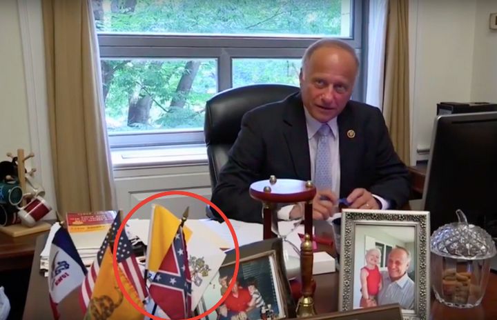 Congressman Steve King is shown with a Confederate flag sitting on his desk.
