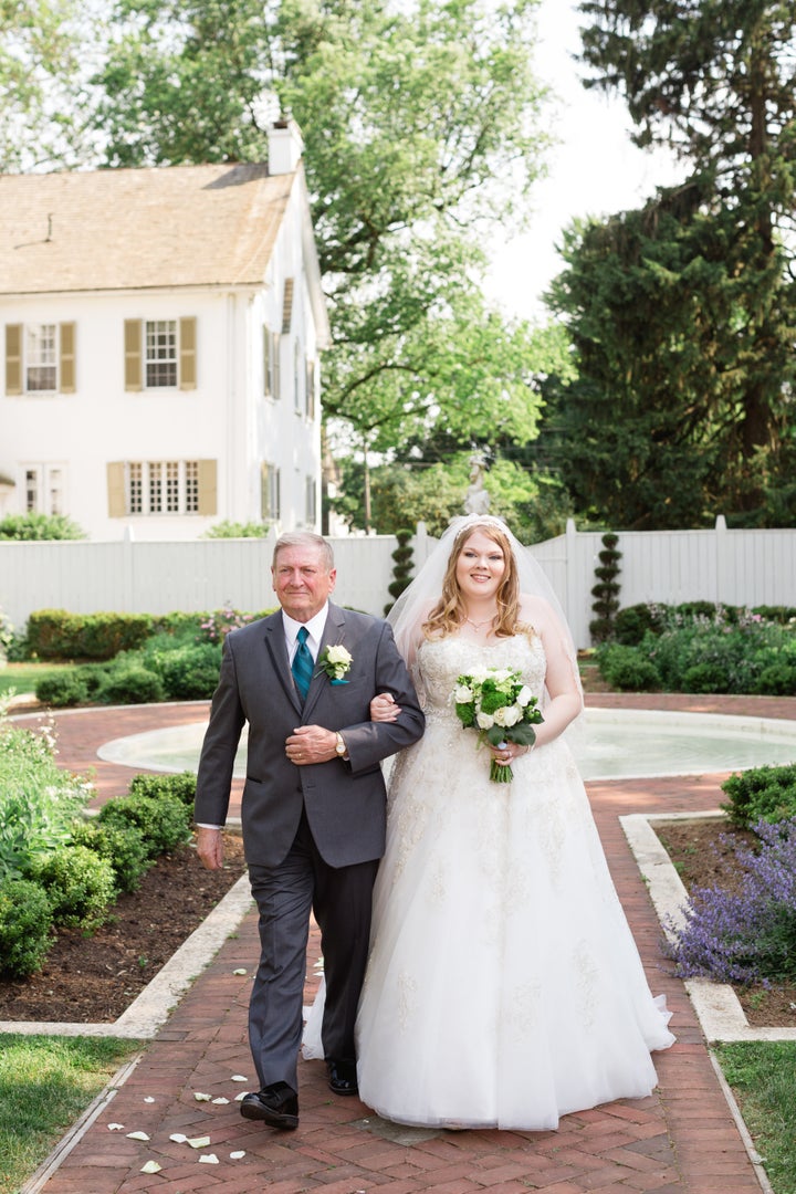 Maggie's grandpa walking her down the aisle. 