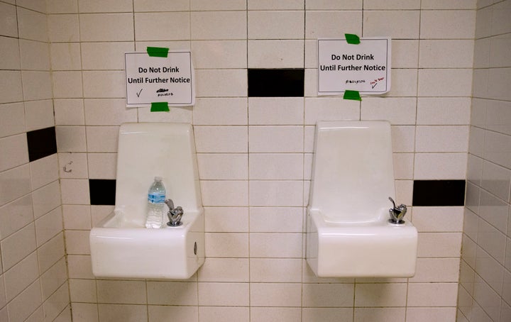 Drinking fountains are marked "Do Not Drink Until Further Notice" at Flint Northwestern High School in Flint, Michigan. Schools across the nation are testing their water for lead. Is it just PR?