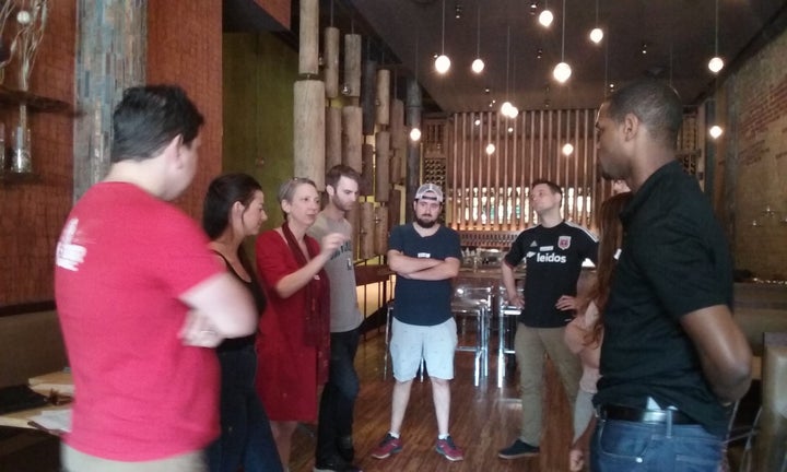 An organizer from Defend Yourself leads a bystander intervention training at a bar in Washington, D.C.