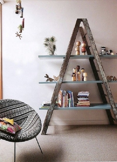 Ladders can be repurposed to hold items normally found in a closet.