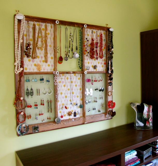 A window is used as a jewelry organizer.