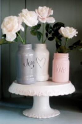 Paint and hot glue transform sauce jars.