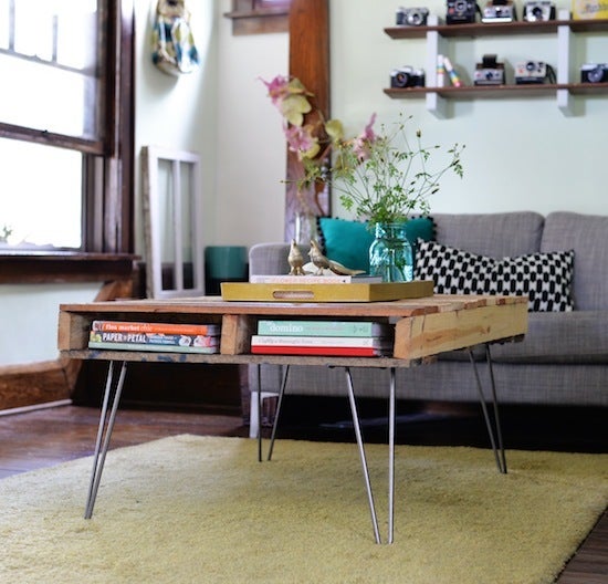 Adding legs to a pallet created a coffee table with a retro vibe.