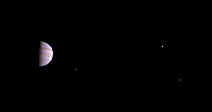 Jupiter and its Great Red Spot can be seen in this first image released by NASA. From left to right, the moons Io, Europa and Ganymede can also be seen.