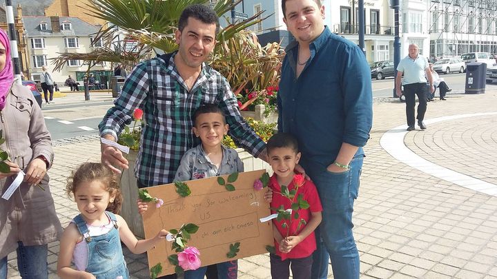 Syrian refugees in Aberystwyth handed out flowers of gratitude to thanks locals for welcoming them to the Welsh town