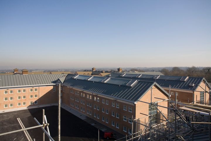 'The problem is serious but it is not out of control. There are a number of prisons where the problem is particularly serious'; pictured above is High Down Prison in Sutton