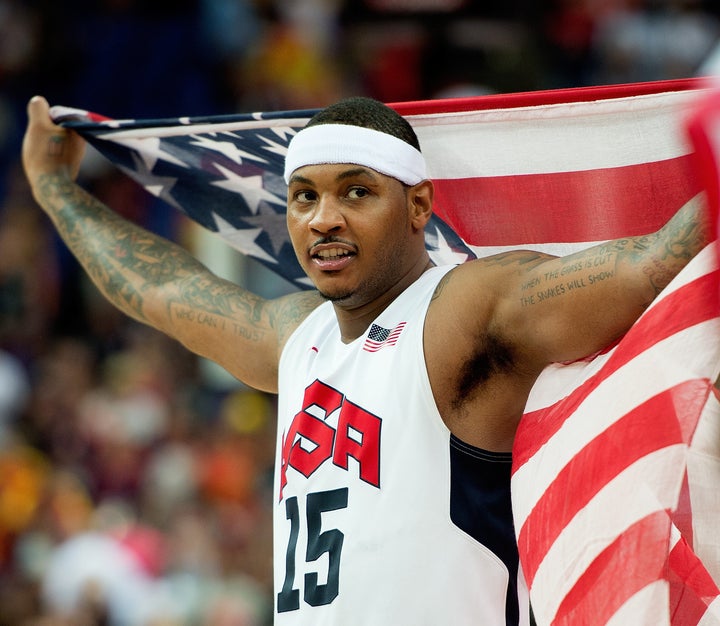 USA's Carmelo Anthony celebrates following their victory over Spain in the Gold Medal game at the at the North Greenwich Aren