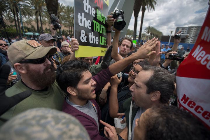 Anti-Trump protesters and Trump supporters clash outside a campaign rally by presumptive GOP presidential nominee Donald Trump in Anaheim, California on May 25, 2016.