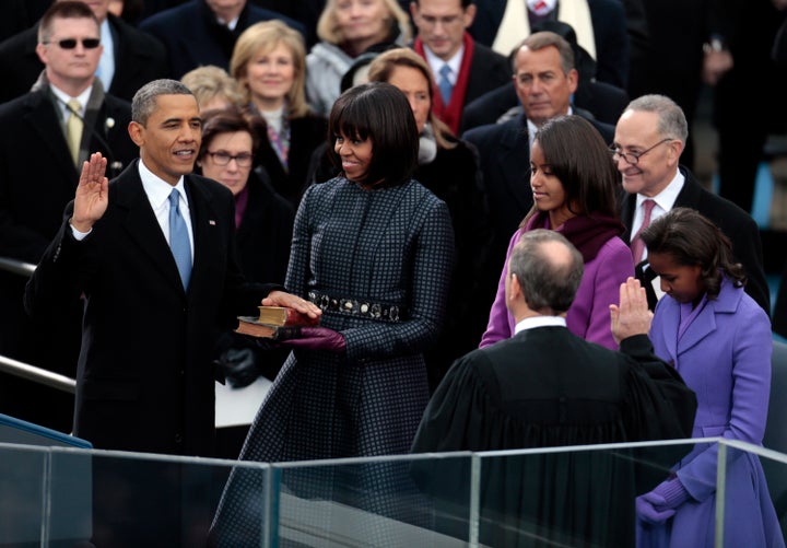 President Barack Obama takes the oath of office from Supreme Court Chief Justice John Roberts as first lady Michelle Obama holds the Lincoln Bible and the traveling bible of slain civil rights leader Martin Luther King Jr. on January 21, 2013.