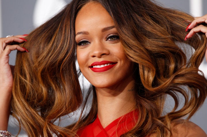 Rihanna has paid far more than Hollande to style her ever-changing 'do.