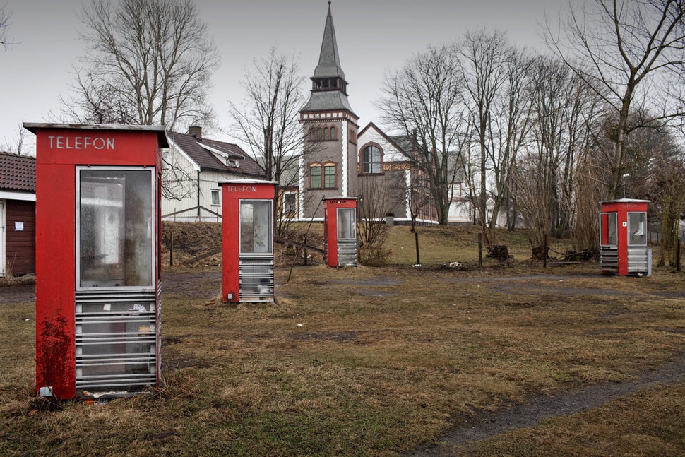 Old telephone booths, part of the heritage of the island and used by the inmates to call outside the prison, are seen in Bast