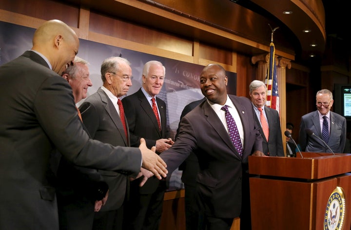 Sen. Tim Scott (R-S.C.) shakes hands with Sen. Cory Booker (D-N.J.) at a news conference on criminal justice reform, Oct. 1, 2015.