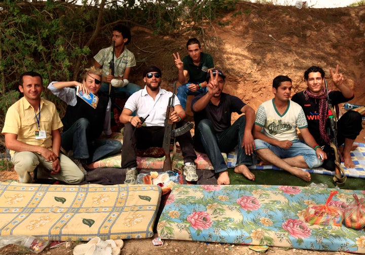 Colvin, second left, poses for a photograph with Libyan rebels in Misrata, northwestern Libya, on June 4, 2011.