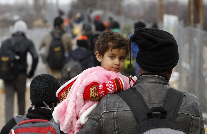 The EU's proposed common asylum system for the bloc has drawn concerns from the U.N. and human rights groups. Above, people walk from a transit center for refugees in Macedonia toward the border with Serbia in January.