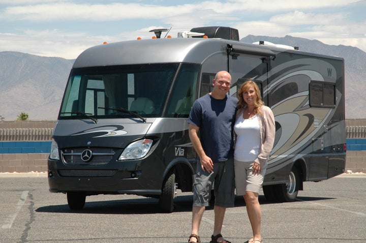 Brad and Amy Herzog in front of their RV for the summer in 2012. Brad Herzog described traveling across the country with his wife as a "second honeymoon."