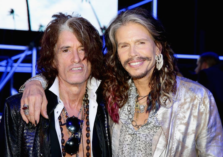 Joe Perry and Steven Tyler attend the Roberto Cavalli show during the Milan Menswear Fashion Week Spring Summer 2015 on June 24, 2014 in Milan, Italy.