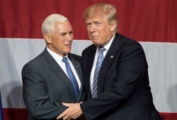Donald Trump greets Mike Pence during a campaign rally in Indiana on Tuesday.