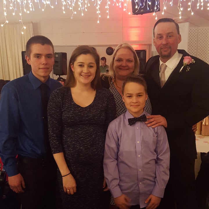 The family at a wedding a few months before Haley and her partner Emilio (left) became parents.