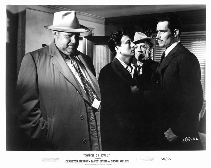 Orson Welles, Charlton Heston and other men in a scene from Welles' classic 1958 film, "Touch Of Evil."