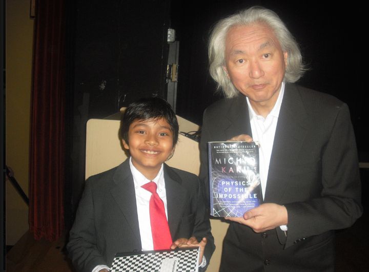 Make Islam Great Again Campaign: Albert, also known as the “13 year-old SAT expert” started sitting in college classrooms at the age of 5. Even Michio Kaku, the most famous scientist of our time, gave him permission to sit in his physics class. In this picture, Albert is collaborating with Kaku at the end of the class.