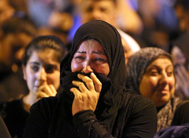 A woman grieves at the scene of the deadly truck bombing.